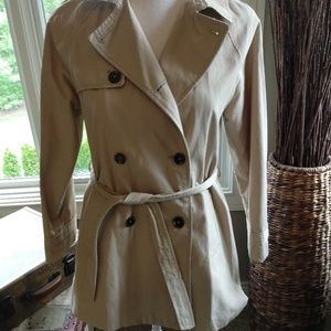 Tan trench coat with large buttons